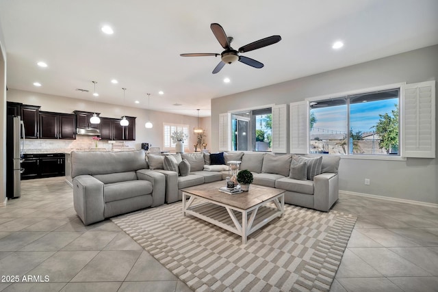 living room with light tile patterned floors and ceiling fan