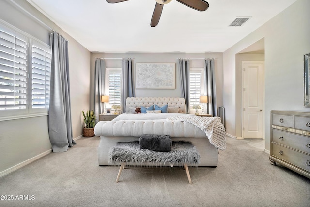 bedroom with light carpet and ceiling fan