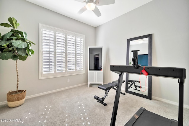 workout room with light colored carpet and ceiling fan