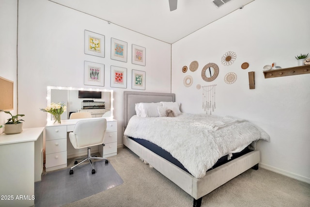 bedroom featuring light colored carpet and ceiling fan