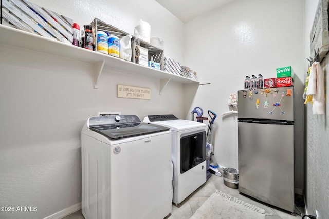 washroom featuring washer and clothes dryer