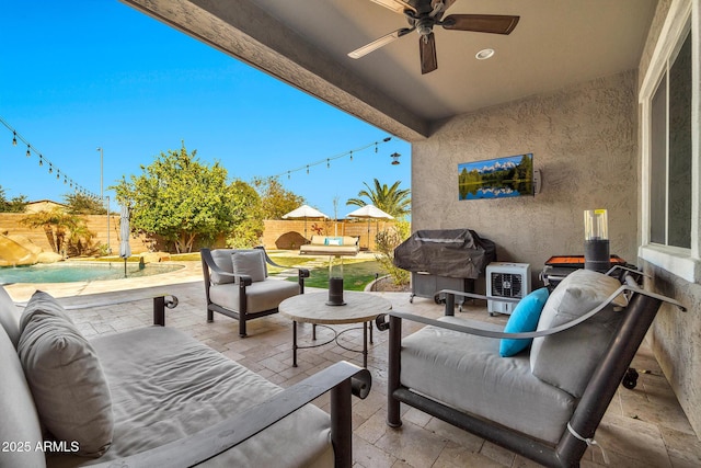 view of patio with ceiling fan, a grill, outdoor lounge area, and a fenced in pool