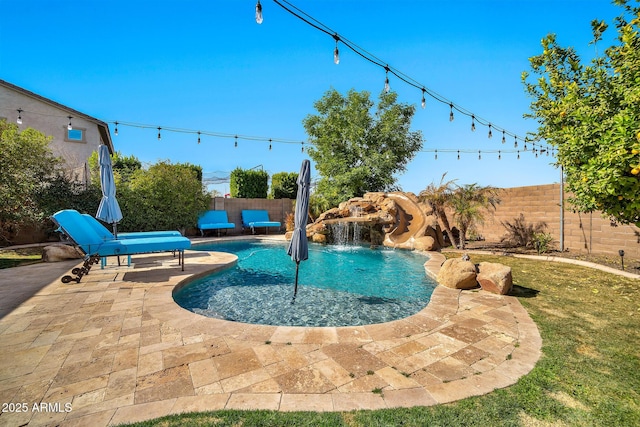 view of swimming pool featuring a patio and a water slide