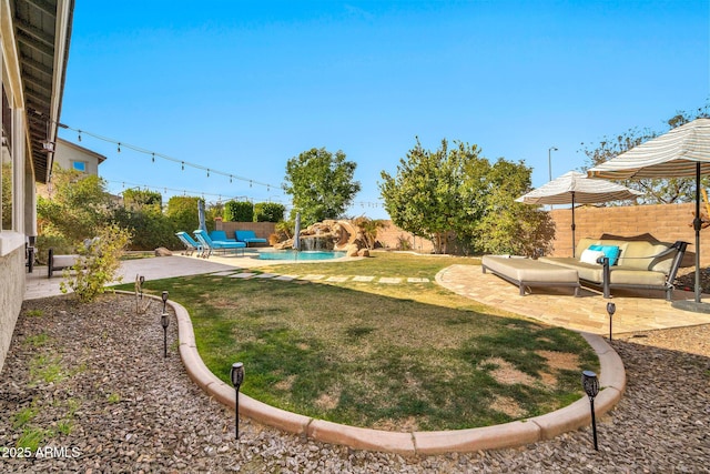 view of yard with a fenced in pool, outdoor lounge area, and a patio area