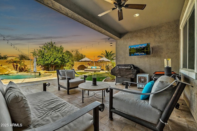 view of patio / terrace featuring ceiling fan, a grill, an outdoor hangout area, and a fenced in pool