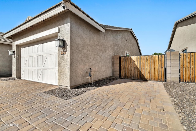 view of side of home featuring a garage