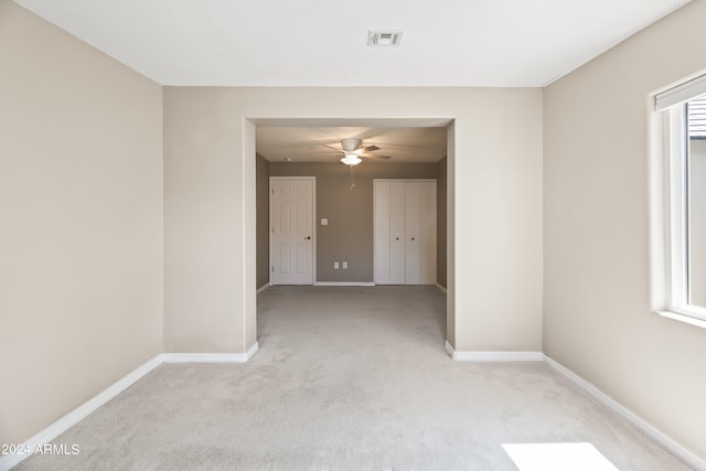 carpeted empty room with ceiling fan