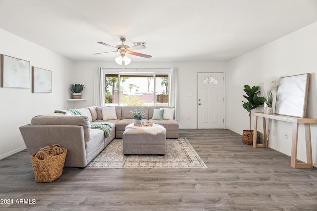 living room with ceiling fan and hardwood / wood-style flooring