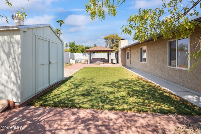 view of yard with a patio, a shed, and a gazebo