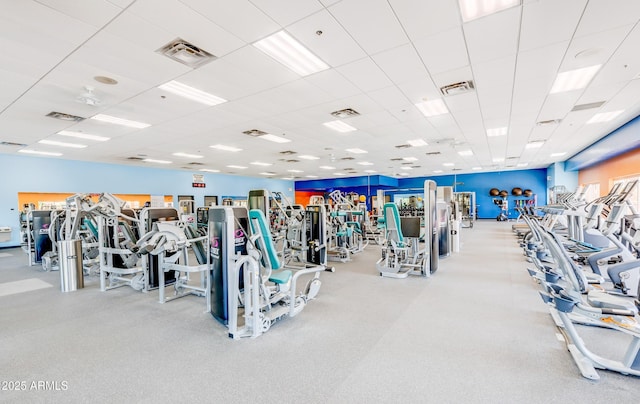 workout area featuring a paneled ceiling and visible vents