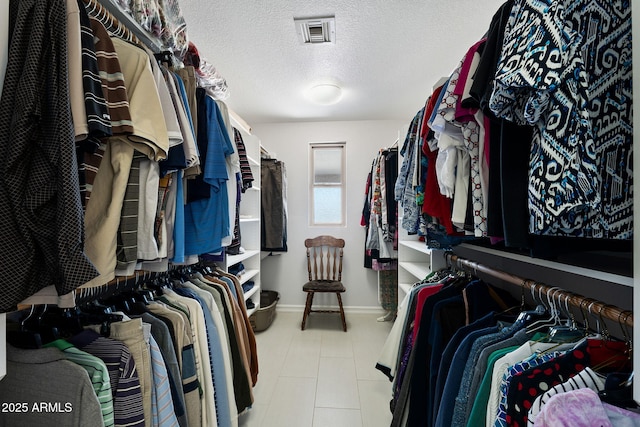 spacious closet with tile patterned flooring and visible vents