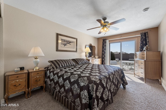 bedroom featuring a textured ceiling, access to outside, carpet flooring, and a ceiling fan