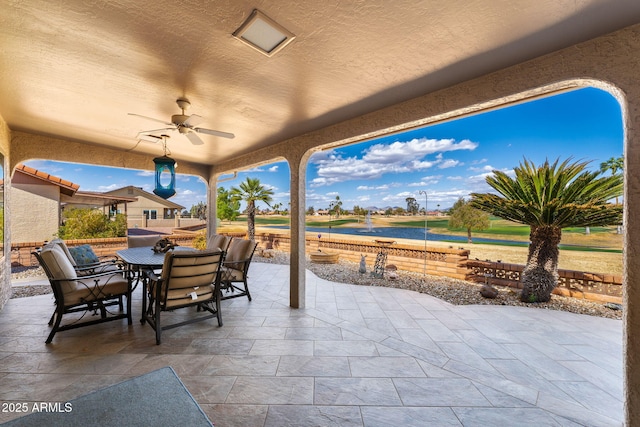 view of patio / terrace featuring outdoor dining area and a ceiling fan