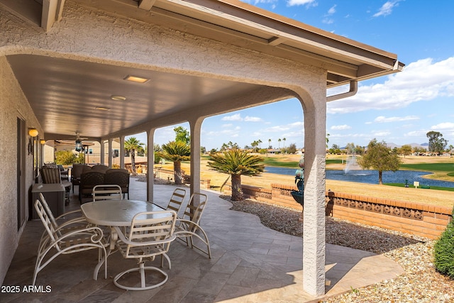 view of patio / terrace featuring ceiling fan and outdoor dining area