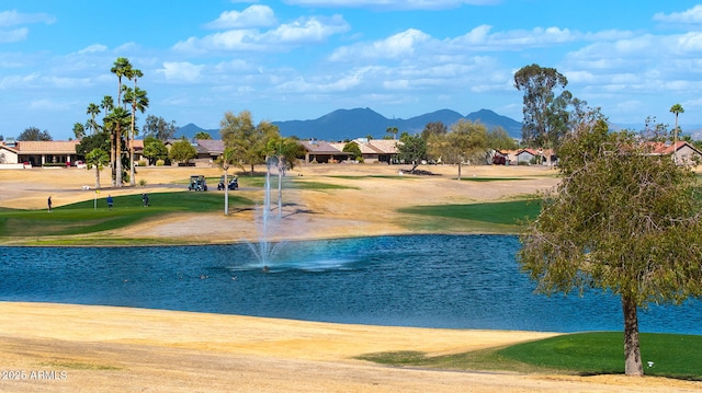 view of home's community with a yard and a water and mountain view