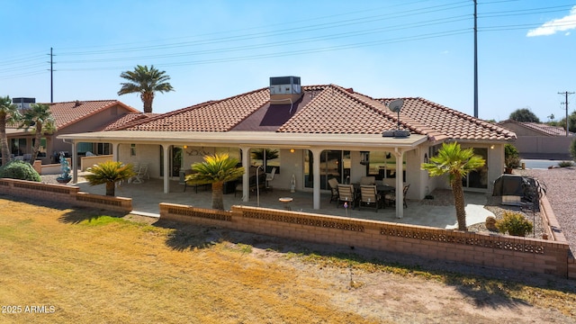 back of property featuring a tile roof, stucco siding, a patio area, and central air condition unit