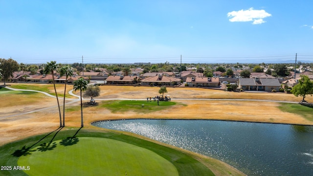 drone / aerial view with a water view, a residential view, and golf course view