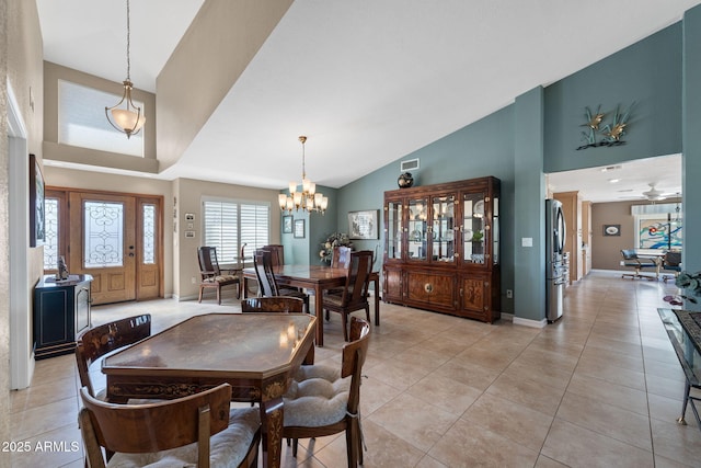 dining room featuring an inviting chandelier, baseboards, visible vents, and light tile patterned flooring