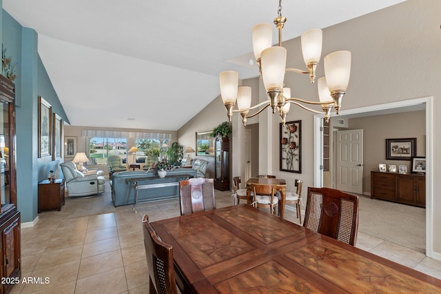 dining space featuring lofted ceiling, light tile patterned floors, and an inviting chandelier