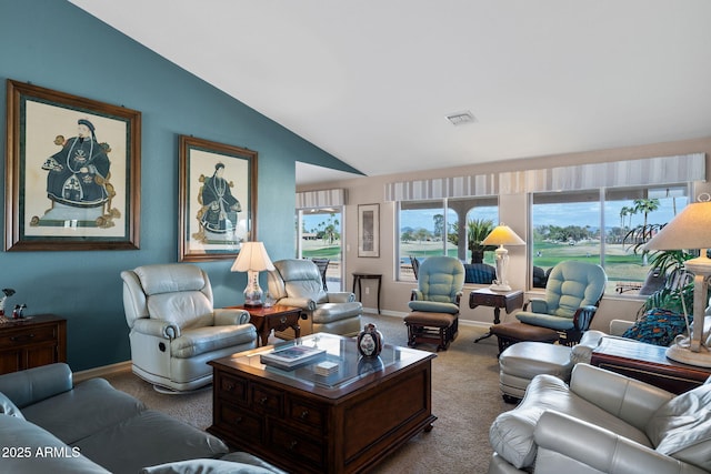 carpeted living room featuring lofted ceiling, visible vents, and baseboards