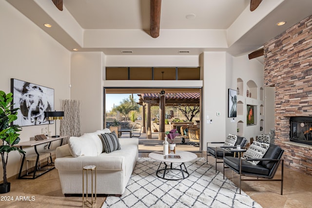 living room featuring a fireplace and beamed ceiling