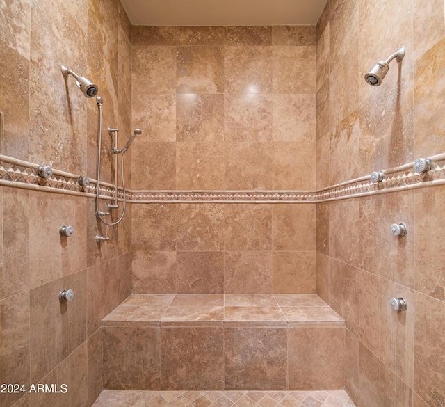 bathroom with a tile shower