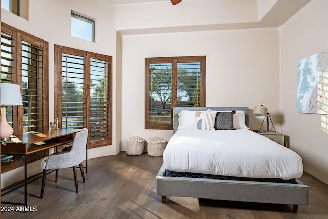 bedroom featuring ceiling fan and dark wood-type flooring