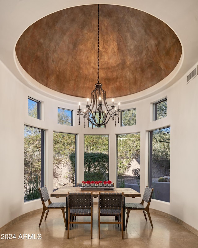 sunroom with a chandelier