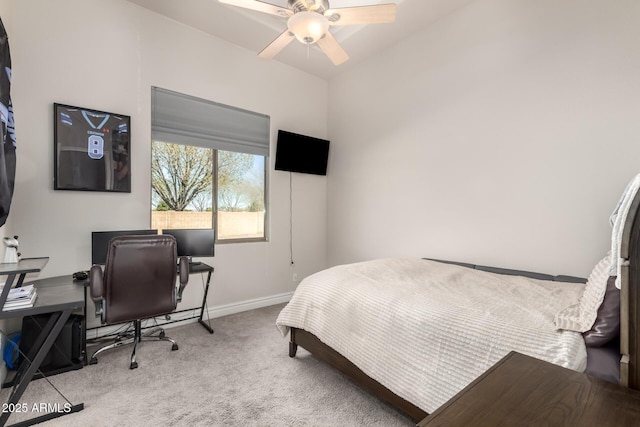 carpeted bedroom featuring ceiling fan and baseboards