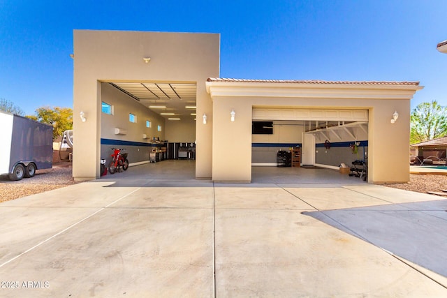 exterior space with concrete driveway