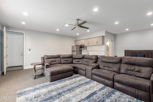 living room featuring carpet floors, a ceiling fan, and recessed lighting