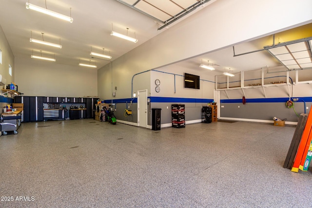 garage featuring baseboards