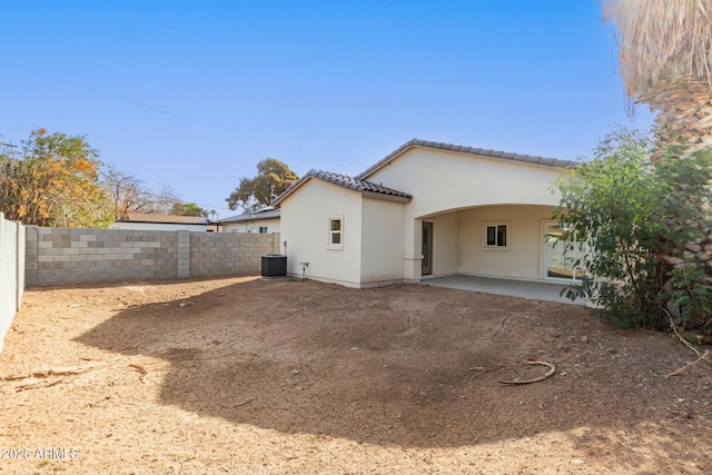 back of property featuring central AC and a patio