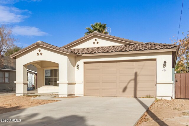 mediterranean / spanish-style home featuring a garage