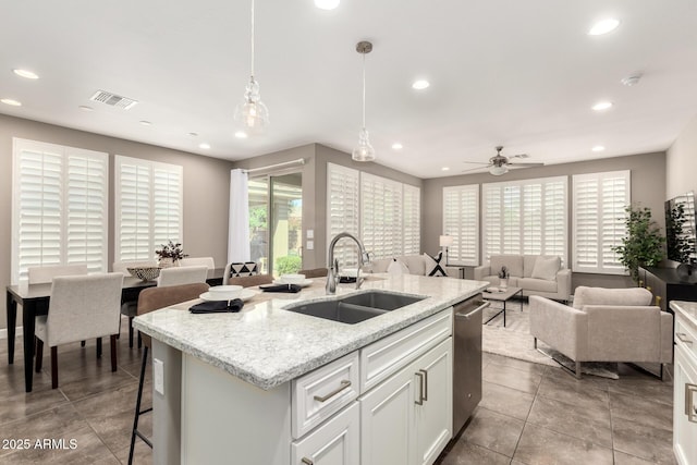 36145 N Desert Tea Dr, Queen Creek, AZ 85140 - kitchen featuring a sink, dishwasher, recessed lighting, open floor plan, and an island with sink
