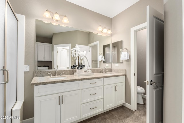 36145 N Desert Tea Dr, Queen Creek, AZ 85140 - full bath featuring toilet, double vanity, and baseboards