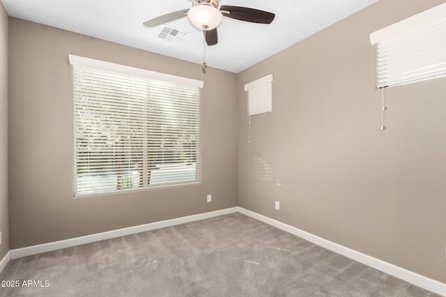 36145 N Desert Tea Dr, Queen Creek, AZ 85140 - spare room with a ceiling fan, baseboards, and carpet floors
