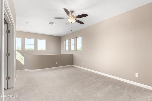 36145 N Desert Tea Dr, Queen Creek, AZ 85140 - empty room with a ceiling fan, baseboards, and light colored carpet