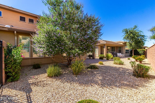 36145 N Desert Tea Dr, Queen Creek, AZ 85140 - view of front of house featuring stucco siding, a patio, and fence