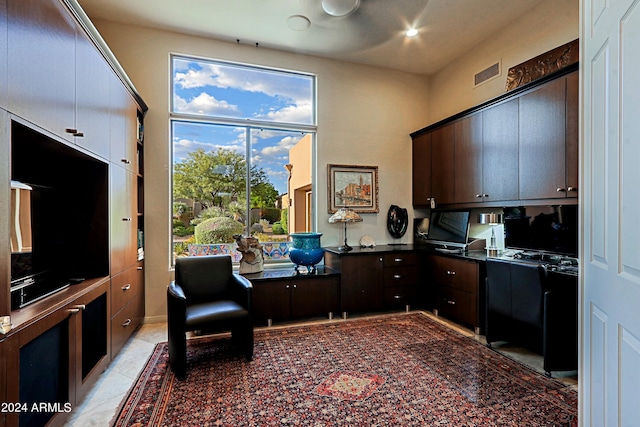 interior space featuring plenty of natural light and light tile patterned floors