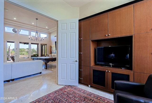 living room with an inviting chandelier, crown molding, light tile patterned floors, a towering ceiling, and pool table