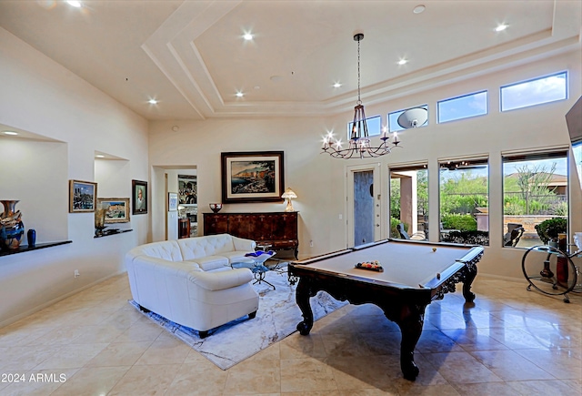 game room featuring light tile patterned flooring, a towering ceiling, a raised ceiling, and pool table