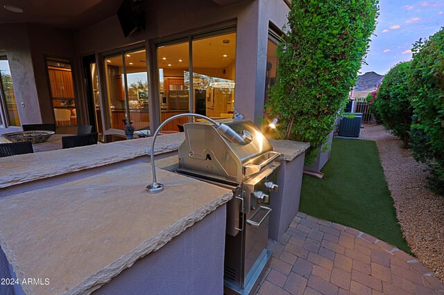 view of patio with grilling area and an outdoor kitchen