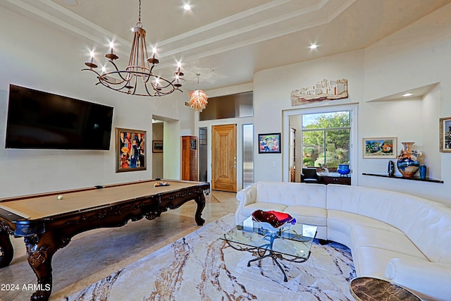 game room featuring a high ceiling, billiards, and a chandelier