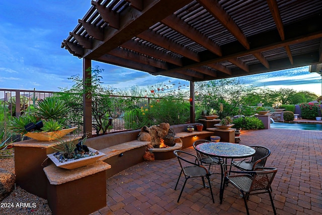 view of patio featuring a fenced in pool and a pergola