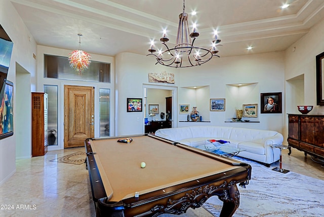 rec room with a high ceiling and billiards