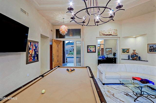 playroom with a towering ceiling and pool table