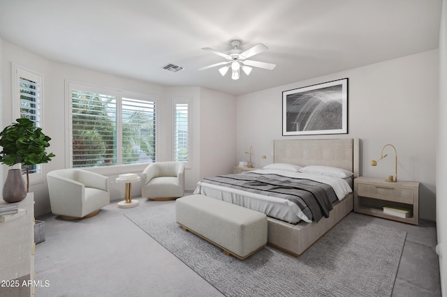 bedroom featuring carpet floors, a ceiling fan, and visible vents