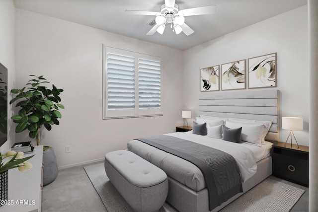carpeted bedroom featuring baseboards and ceiling fan