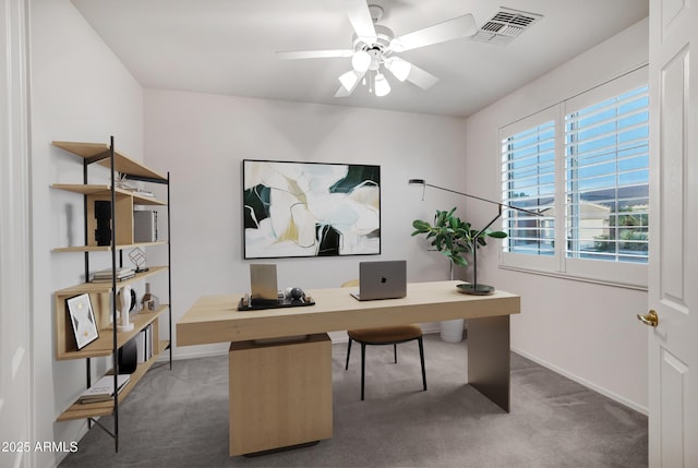 home office with baseboards, ceiling fan, carpet flooring, and visible vents